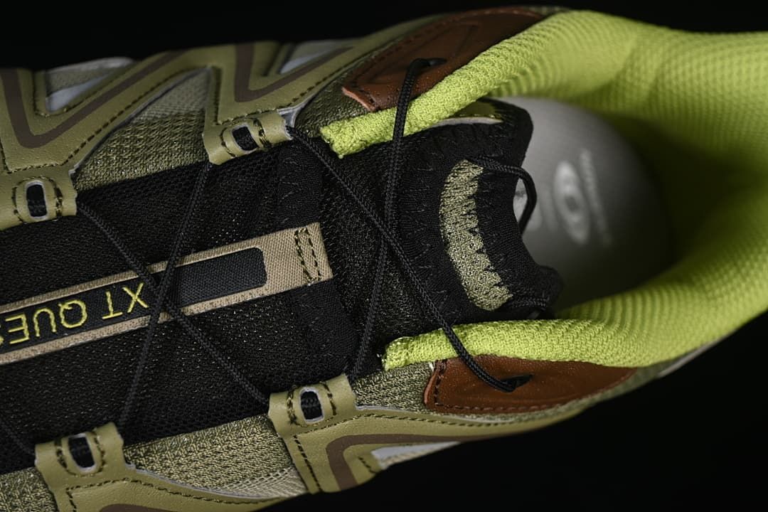 Top-down detail of the black tongue, lace system, and bright lining.