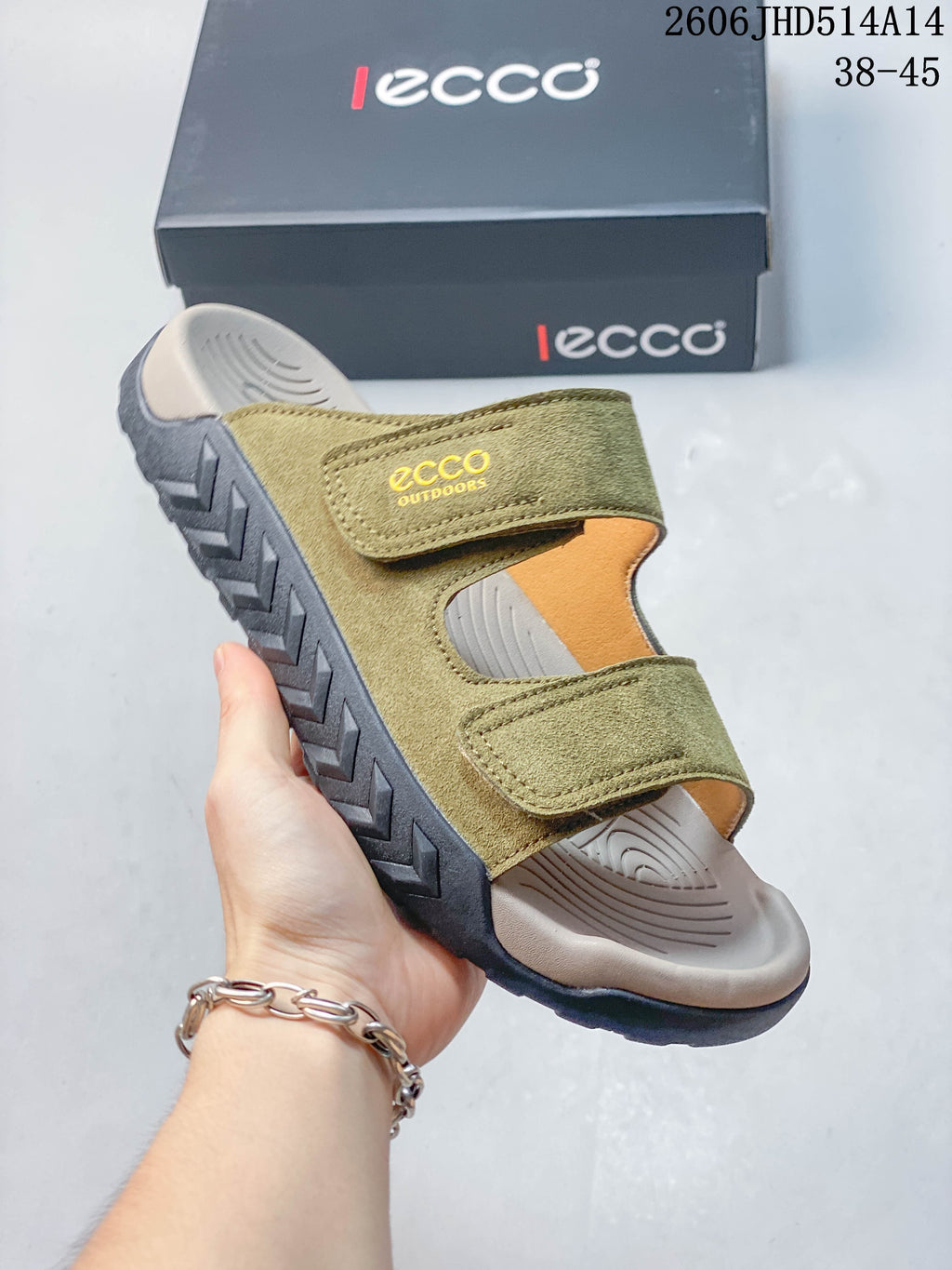 Side view of an olive green two-strap sandal showing its contoured footbed and dark treaded outsole.