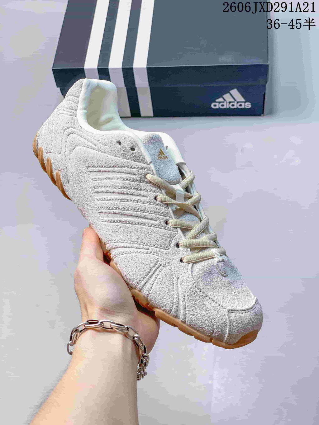 Cream adidas Ghost Sprint sneaker with sculpted side panels and a gum-colored outsole.