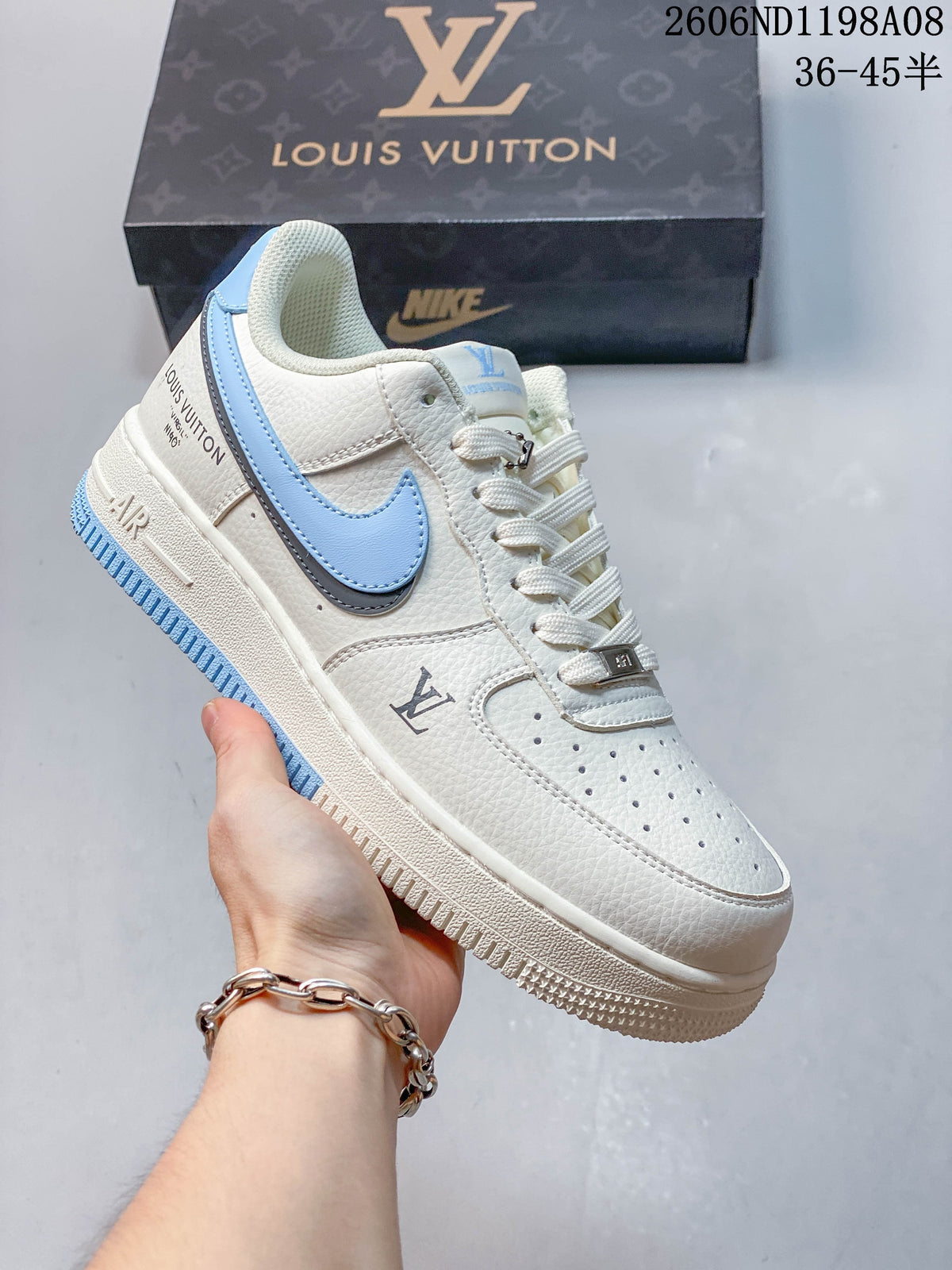 Angled side view of the sneaker with light blue Swoosh and visible branded details
