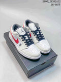 Pair of white low-top Jordan sneakers with red side accents, dark laces, and grey details