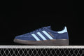 Side view of navy adidas Handball Spezial sneakers with pale blue stripes and brown sole