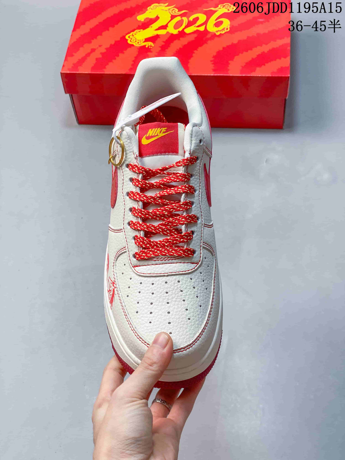 Top view of the Nike Air Force 1 Low showing perforated toe, red-and-white laces, and tongue branding