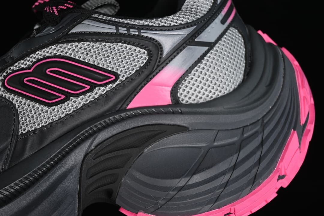 Close-up of the layered side panels, mesh-look sections and pink accents