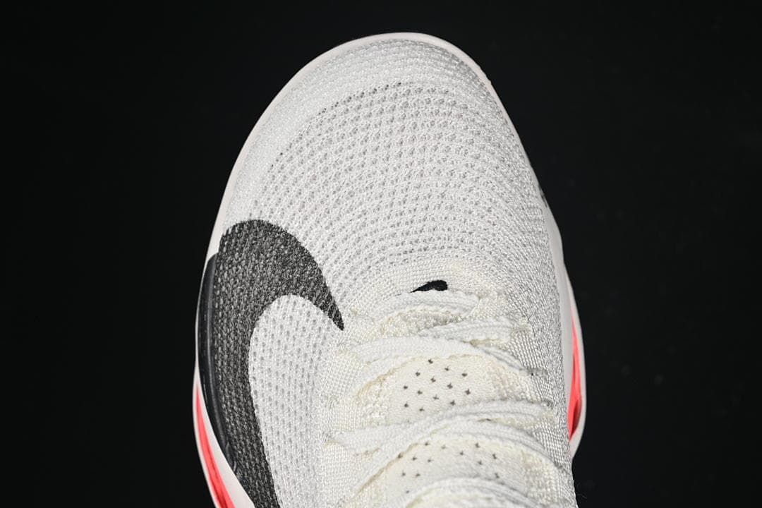 Top view of the knit toe, laces, and black Swoosh
