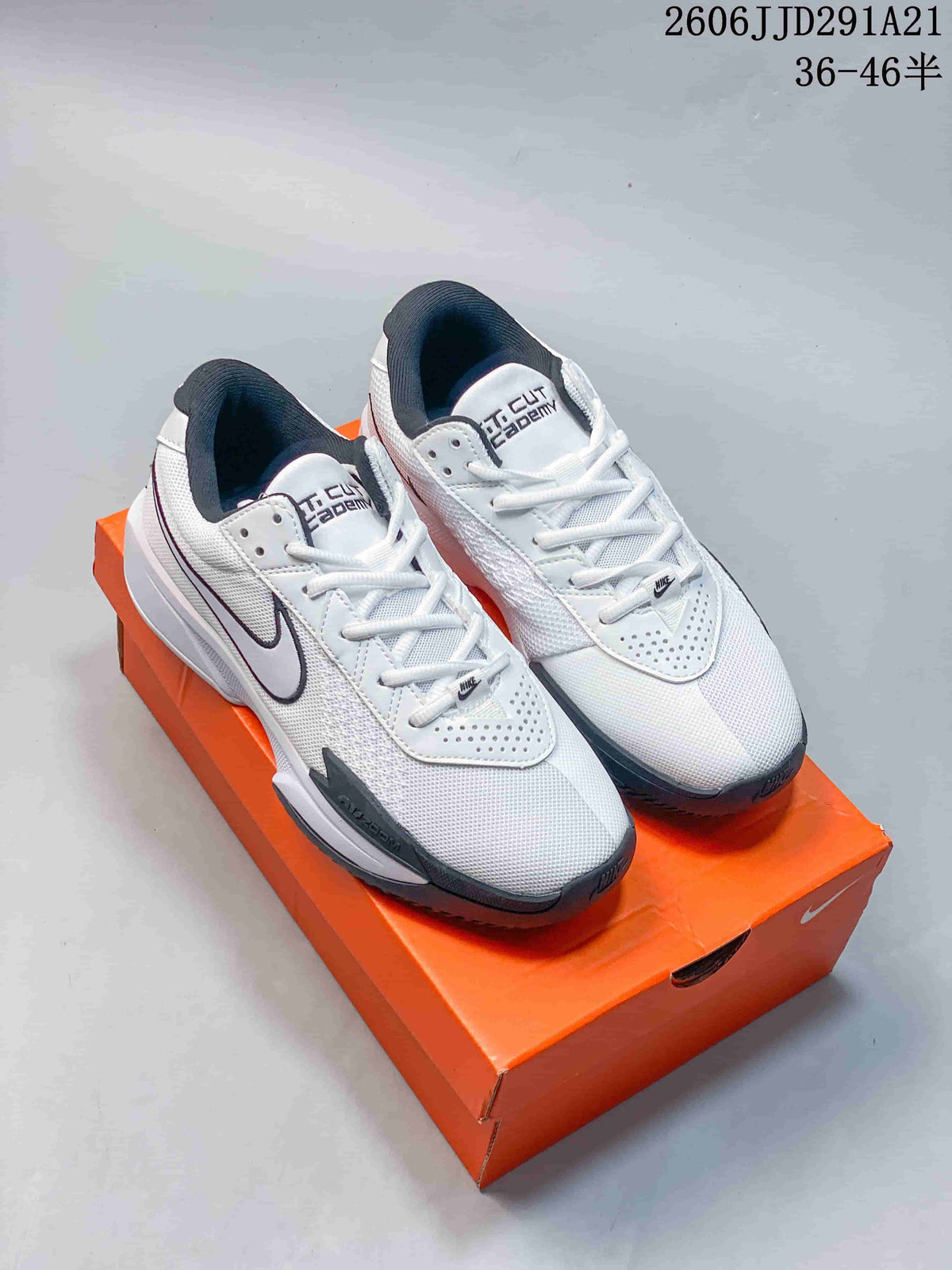 Pair of white and dark gray Nike G.T. Cut 3 EP basketball shoes displayed on an orange shoebox.