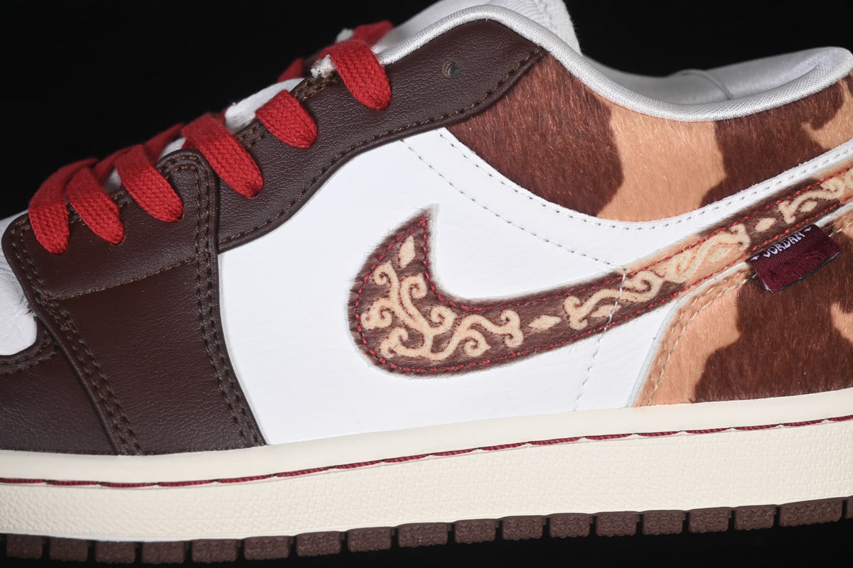 Close-up of the patterned Swoosh, white side panel, and brown overlays.