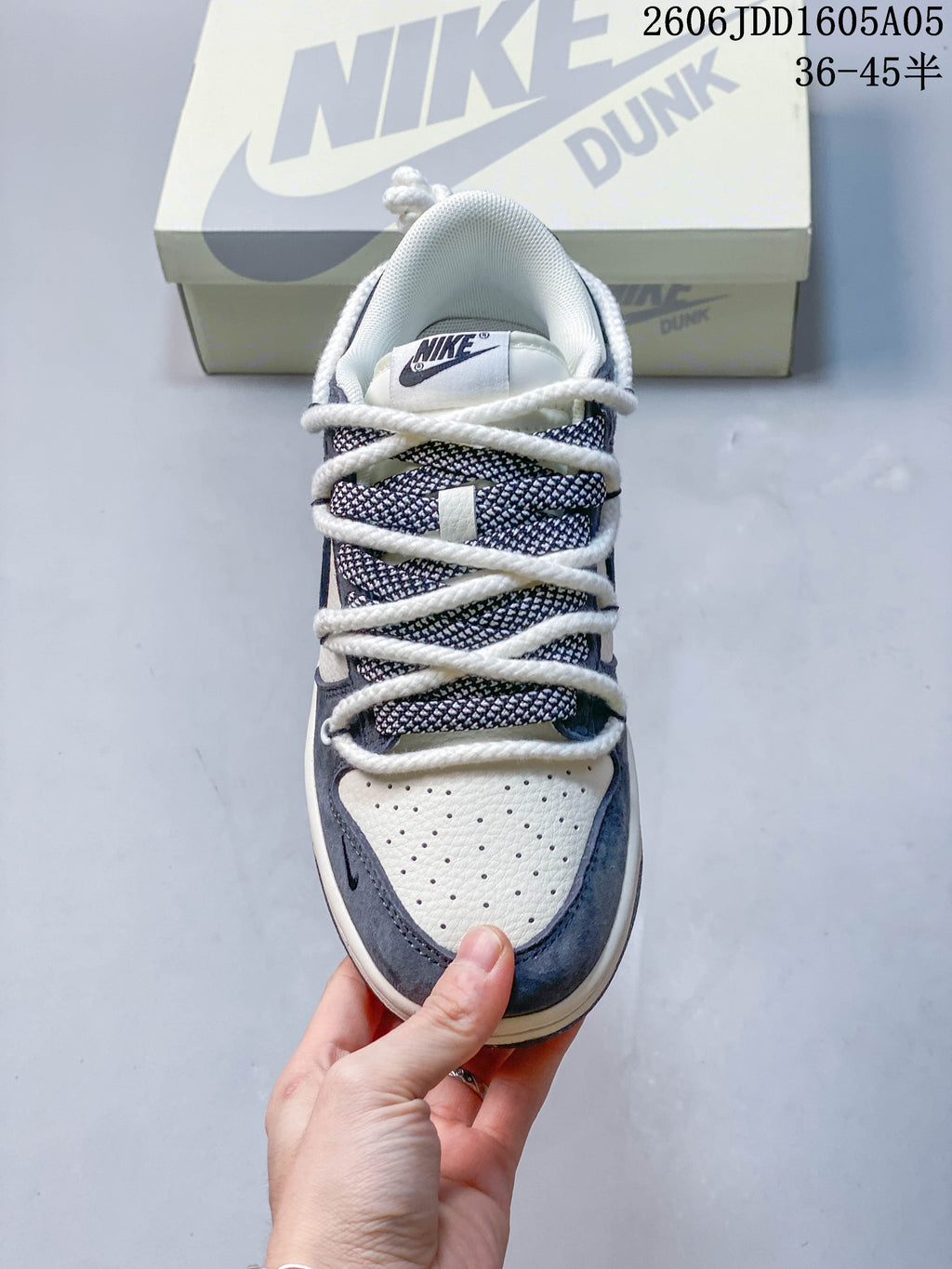 Top view of the perforated toe and patterned tongue panel on a Nike SB Dunk Low sneaker