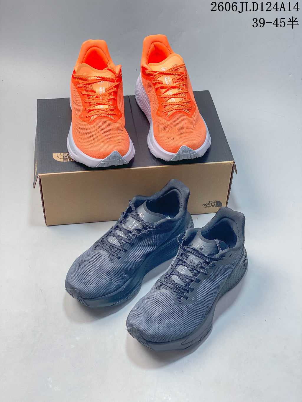 Orange and gray trail-running shoes shown together