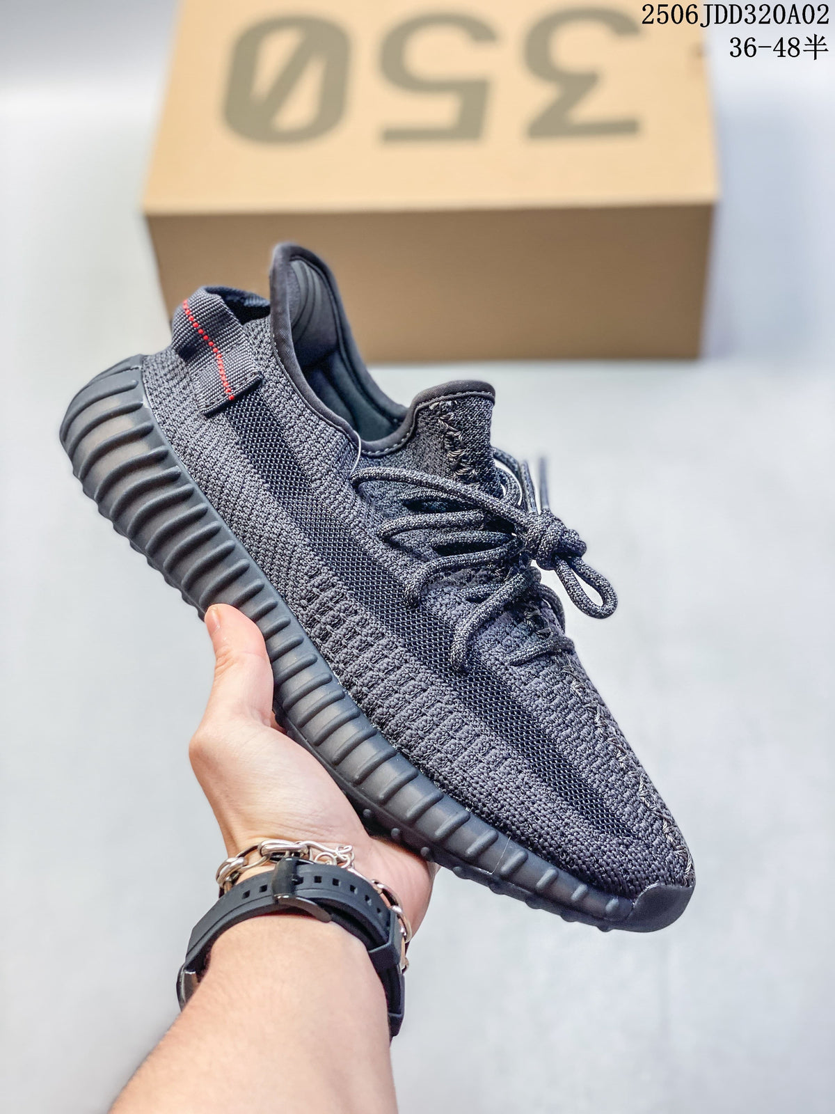 Dark gray Adidas Yeezy-style sneaker with a ribbed sole