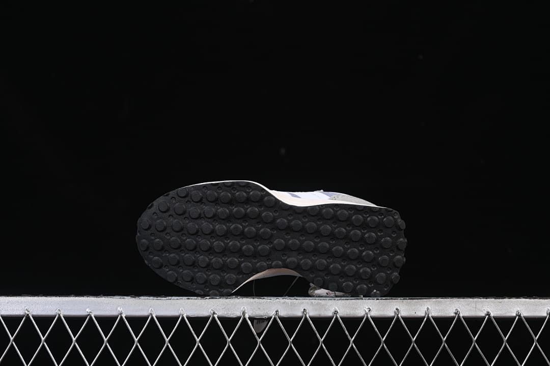 Underside view showing the black outsole with circular tread.