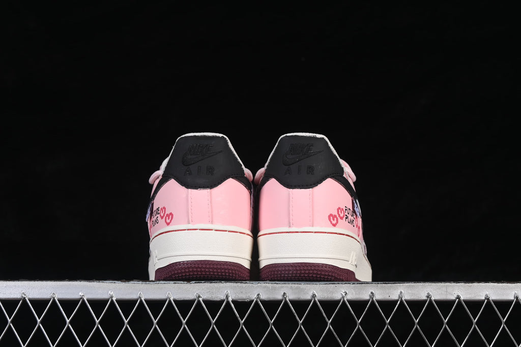 Rear view of the pair showing black heel tabs and pink heel panels