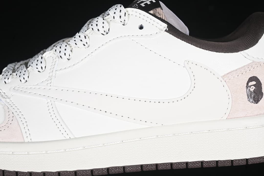 Side detail of the white upper, patterned laces, and heel graphic