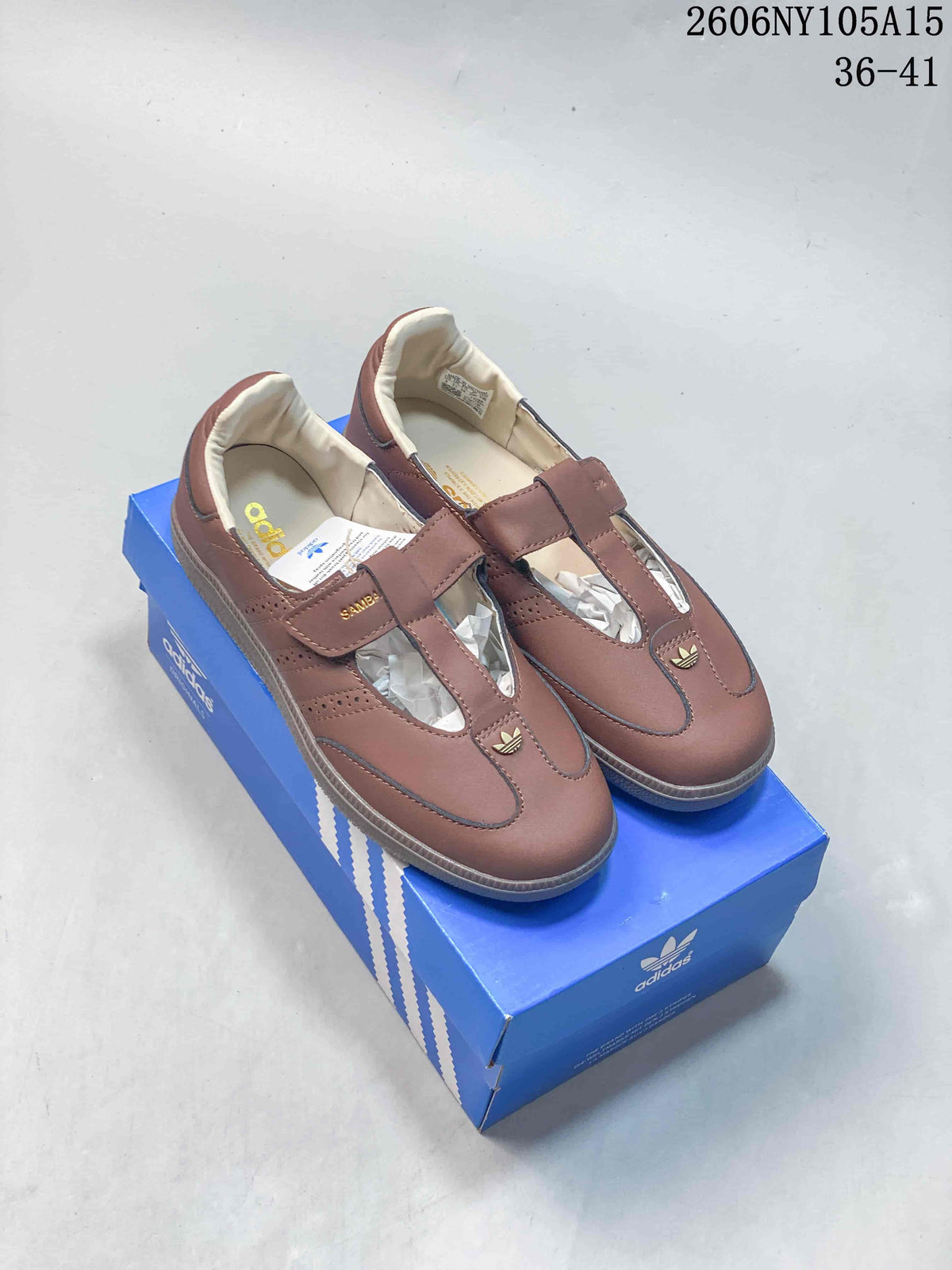 Pair of mauve-brown Samba Jane-style Mary Jane sneakers displayed on a blue shoe box