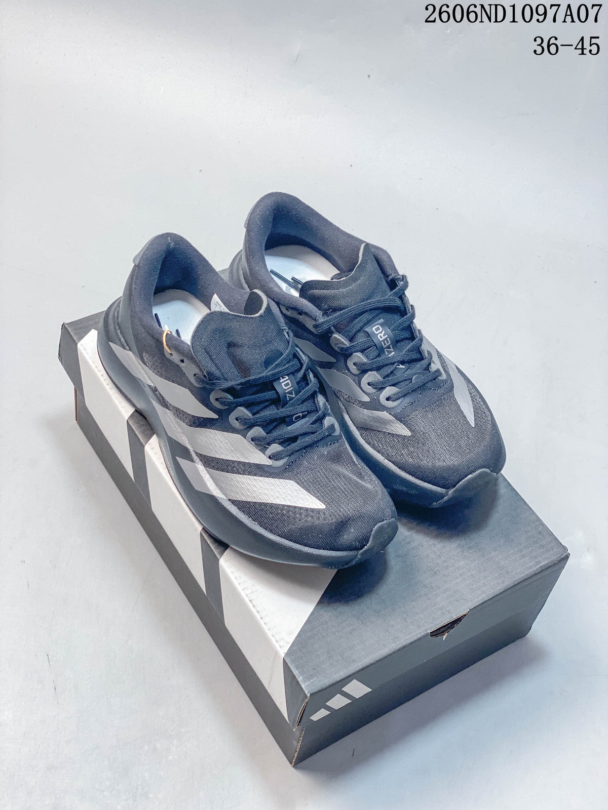 Pair of dark gray adidas Adizero Evo SL running shoes with silver-tone stripes, displayed on a shoebox.