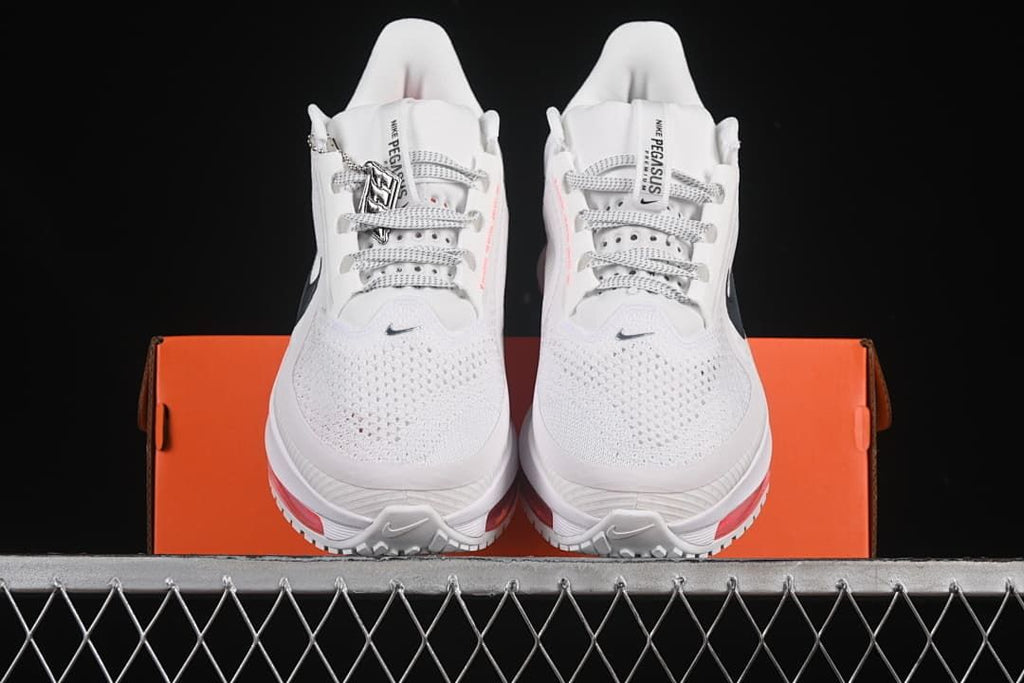 Front view of the pair showing mesh toe boxes, laces, and red outsole accents.