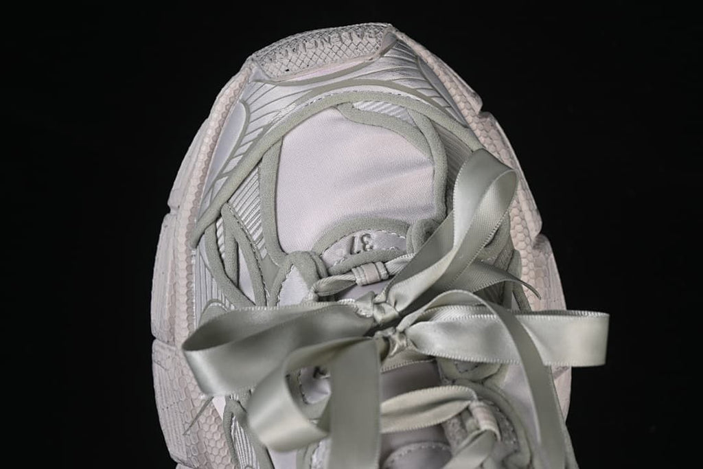 Top view of the sneaker and oversized ribbon bow