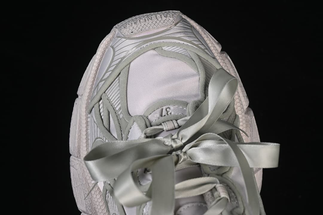 Top view of the sneaker and oversized ribbon bow
