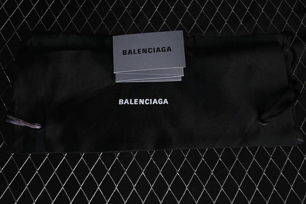 Black dust bag and cards bearing Balenciaga branding