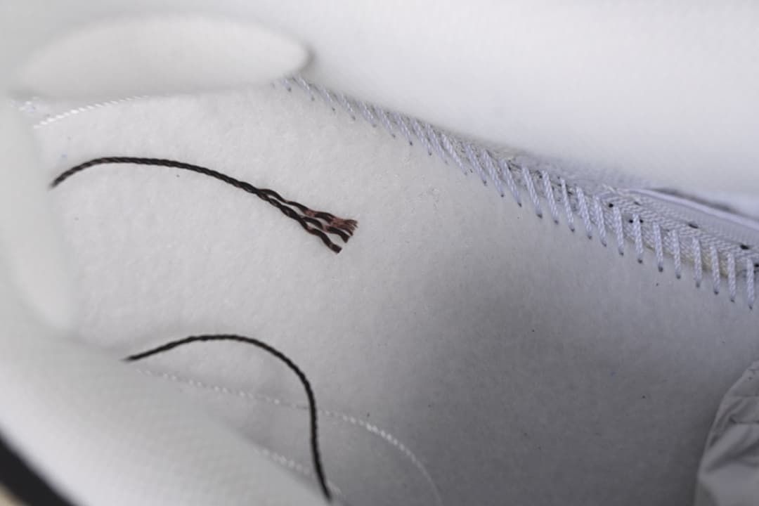 Close-up of the light-colored shoe lining and stitched detail.