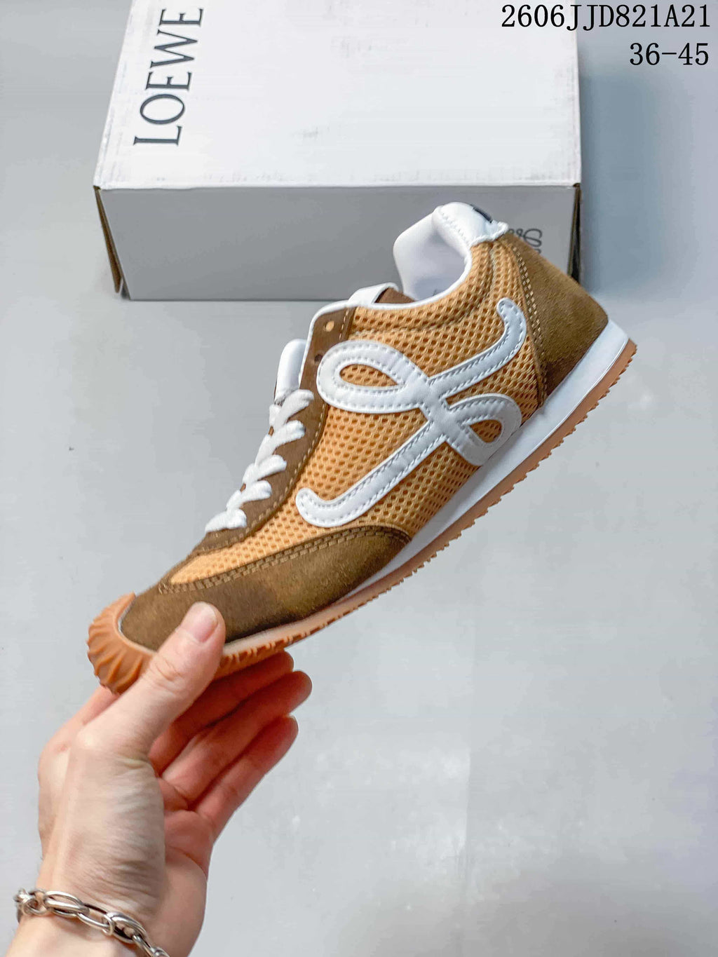 Side view of the sneaker showing mesh panels and a large white side emblem