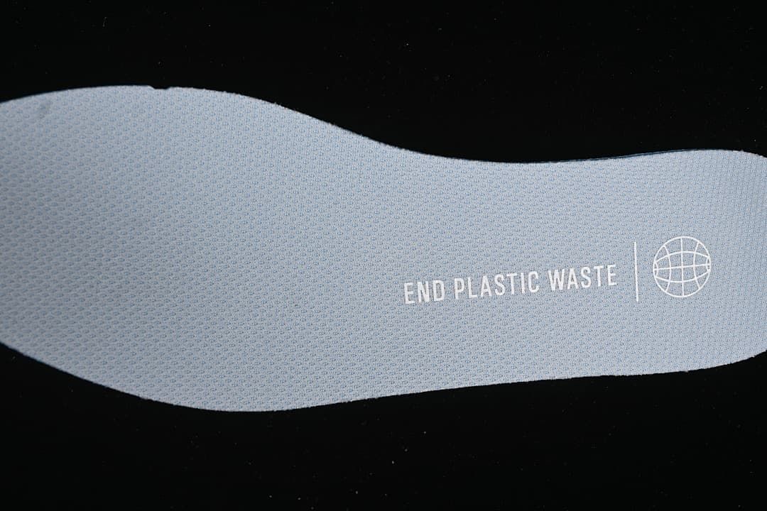 Close-up of a gray shoe insole with printed text