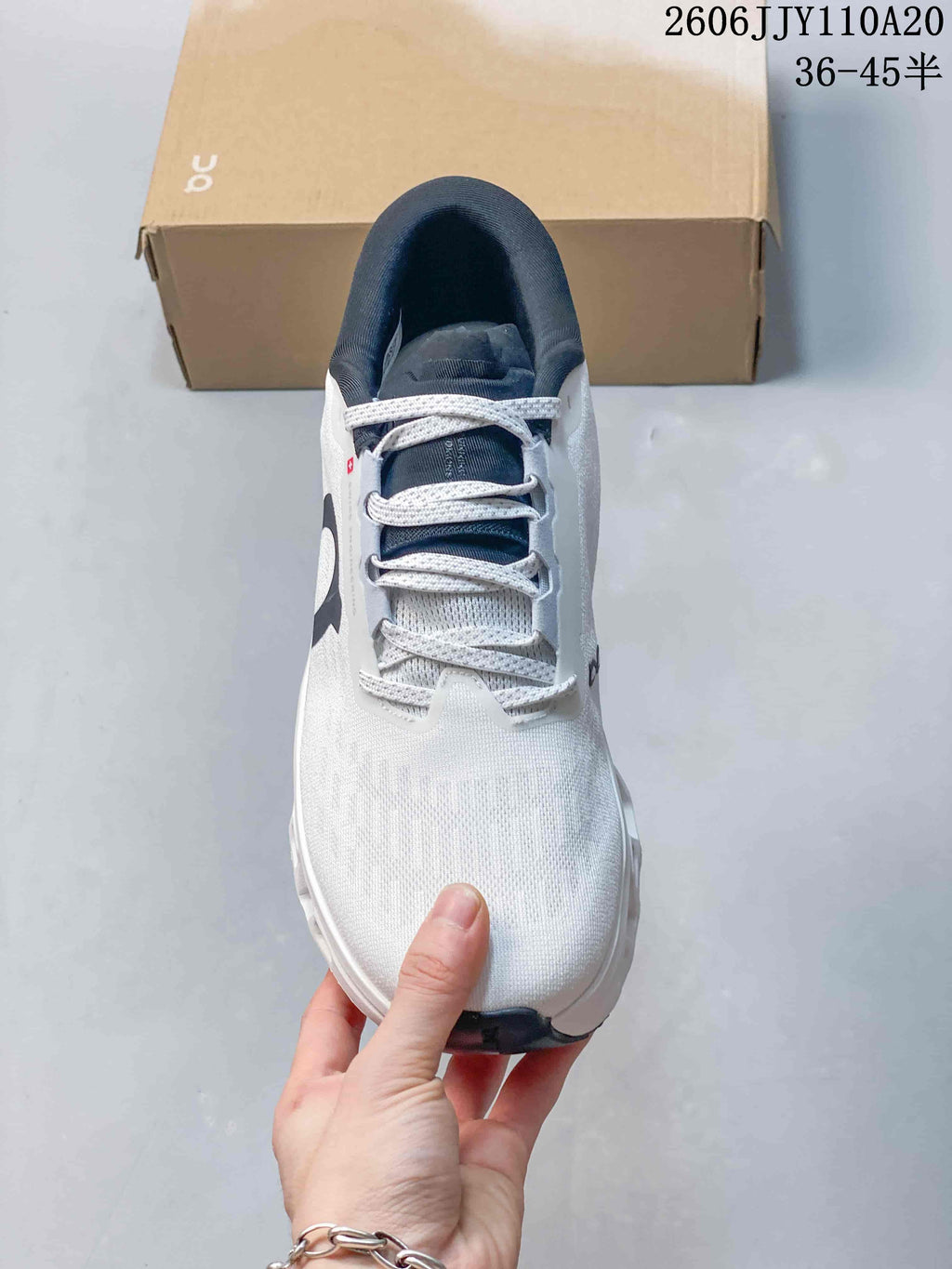 Top view of the On Cloudmonster 3 showing its laces, tongue, and white upper