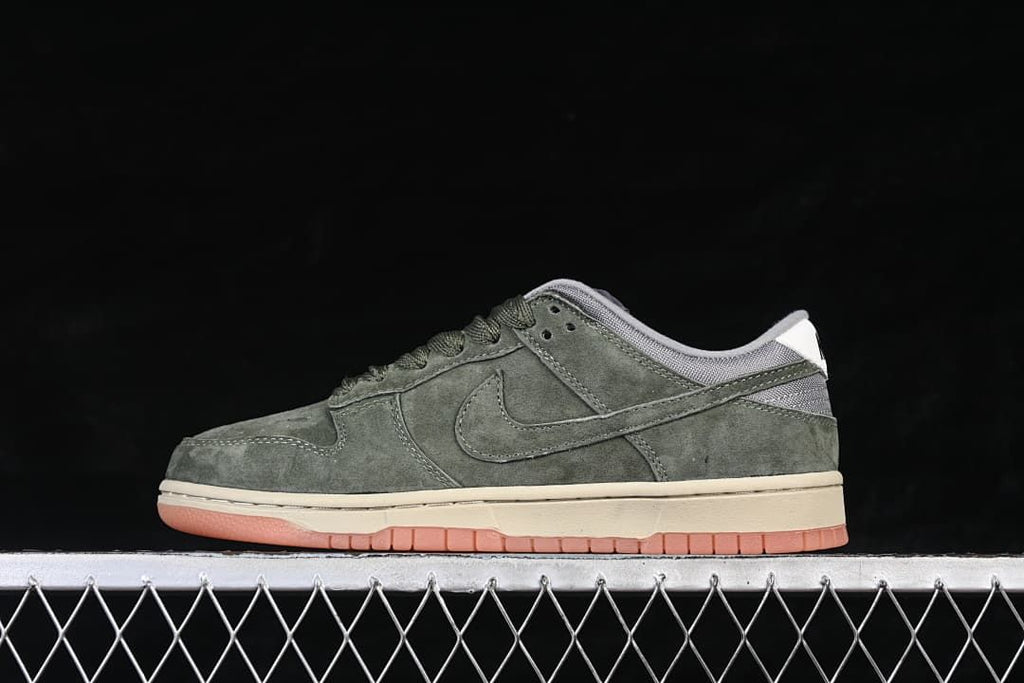 Side view of an olive-green Nike SB Dunk Low with a light midsole and gum-toned outsole
