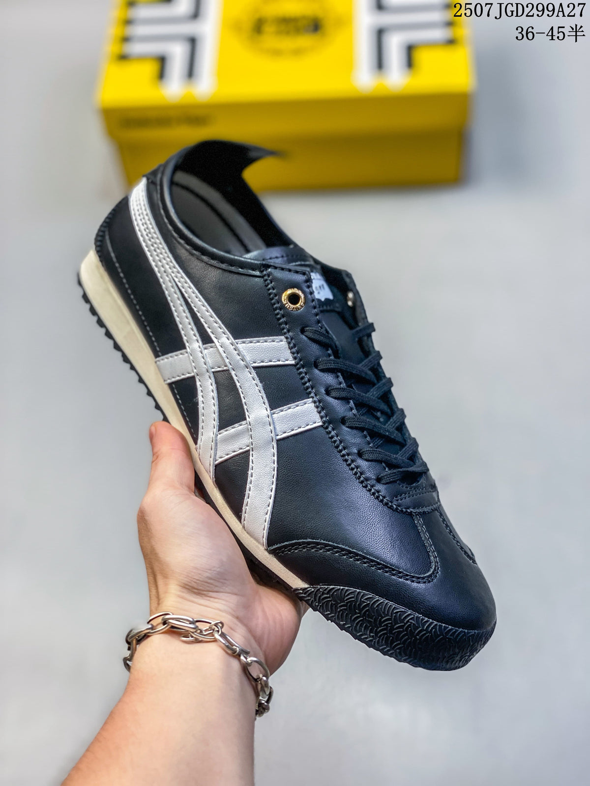 Angled side view of the black and silver sneaker