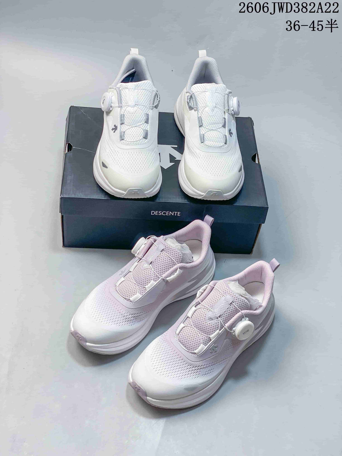 White DESCENTE running shoes shown from front and angled views
