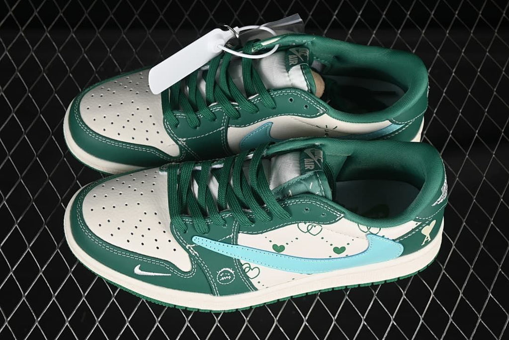Pair of green and off-white low-top sneakers with light blue Swooshes and heart graphics, viewed from above