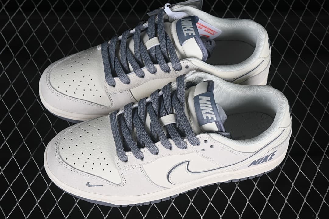 Pair of beige and gray Nike SB Dunk Low sneakers shown from above