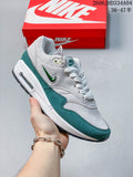 Selection of Nike Air Max 1 sneakers in different colorways arranged in a circle.