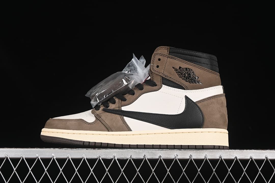 Side view of a brown, white, and black high-top sneaker with a reverse-style black Swoosh