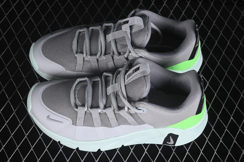 Angled top view showing the gray mesh toe boxes, lace-up construction, padded collars, and bright green heel accents.