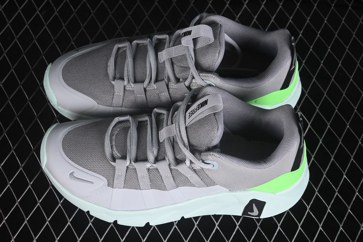 Angled top view showing the gray mesh toe boxes, lace-up construction, padded collars, and bright green heel accents.