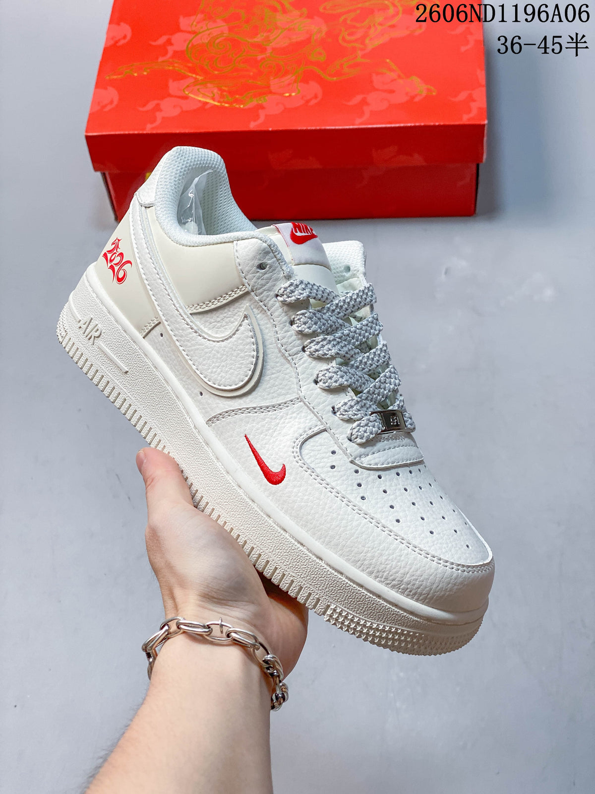 Side view of an off-white low-top sneaker with red accents and a horse-themed graphic