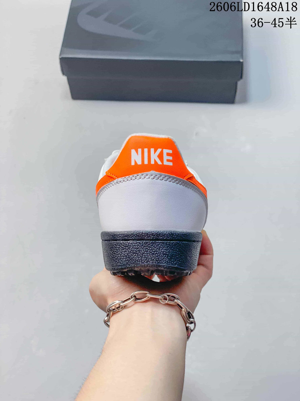 Rear view of the sneaker showing its orange heel tab and dark outsole
