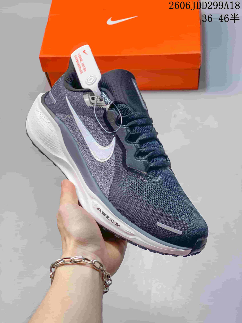 Close side view of a dark gray Nike Pegasus 41 running shoe with light-colored logo