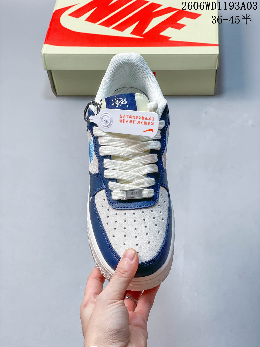 Top view showing the perforated toe, white laces, and blue trim
