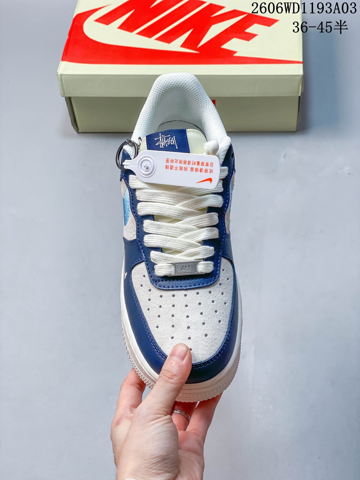 Top view showing the perforated toe, white laces, and blue trim