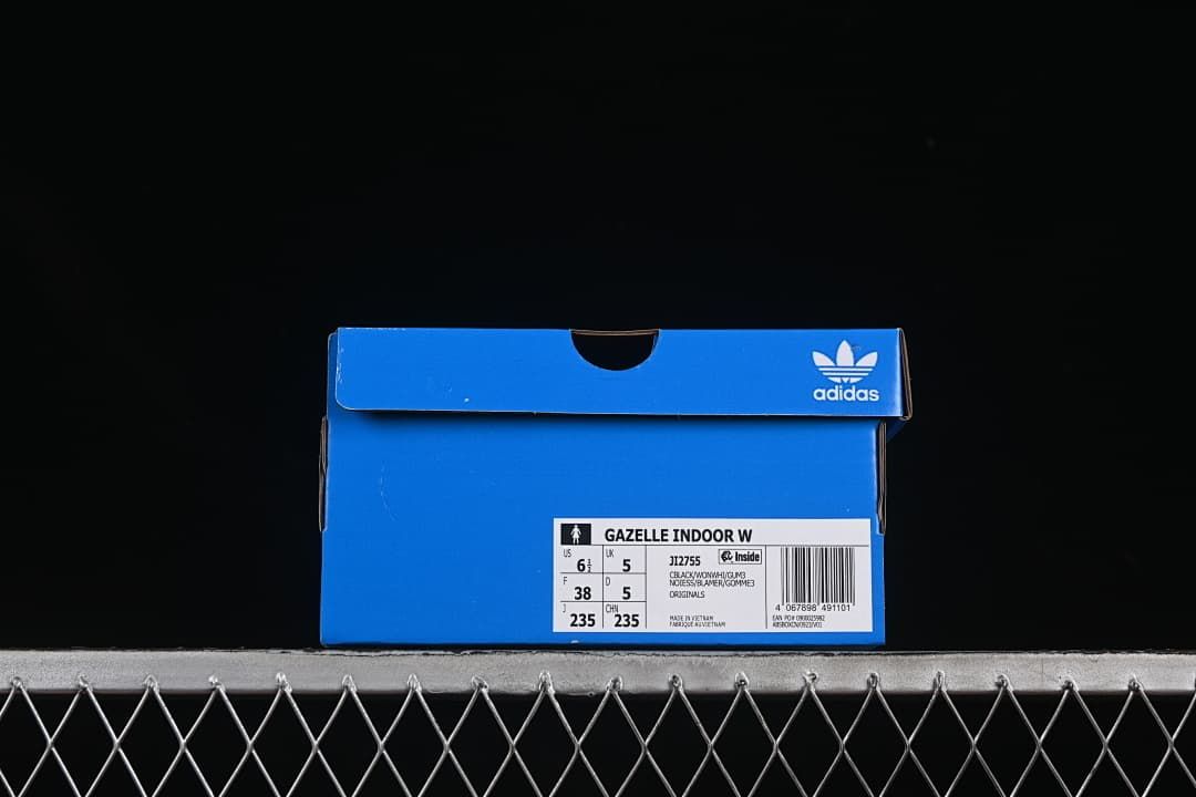 Blue shoe box with a label showing Gazelle Indoor W, model JI2755 and size markings.