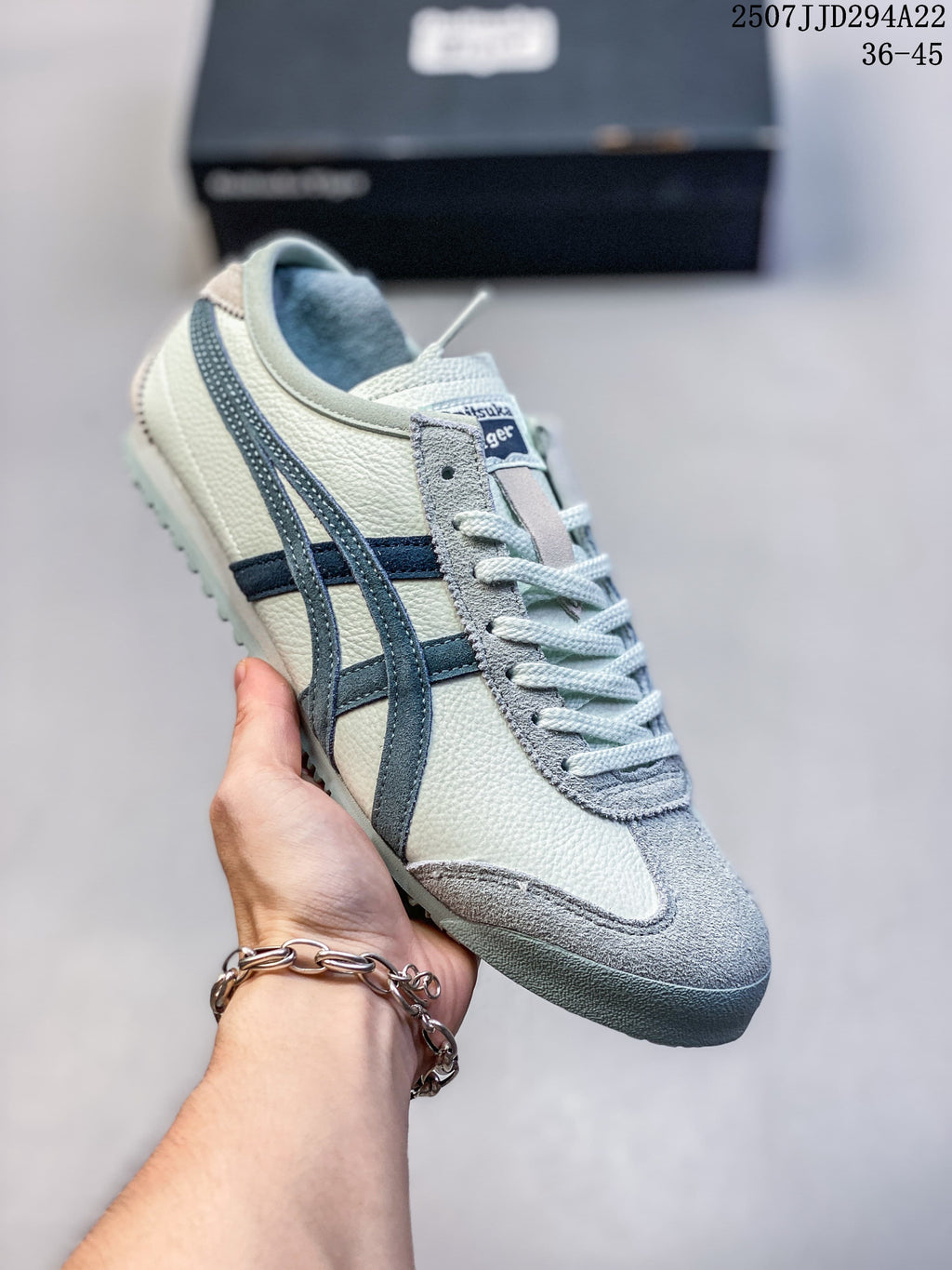 Cream Mexico 66 Deluxe sneaker with blue-gray side stripes and a textured toe overlay