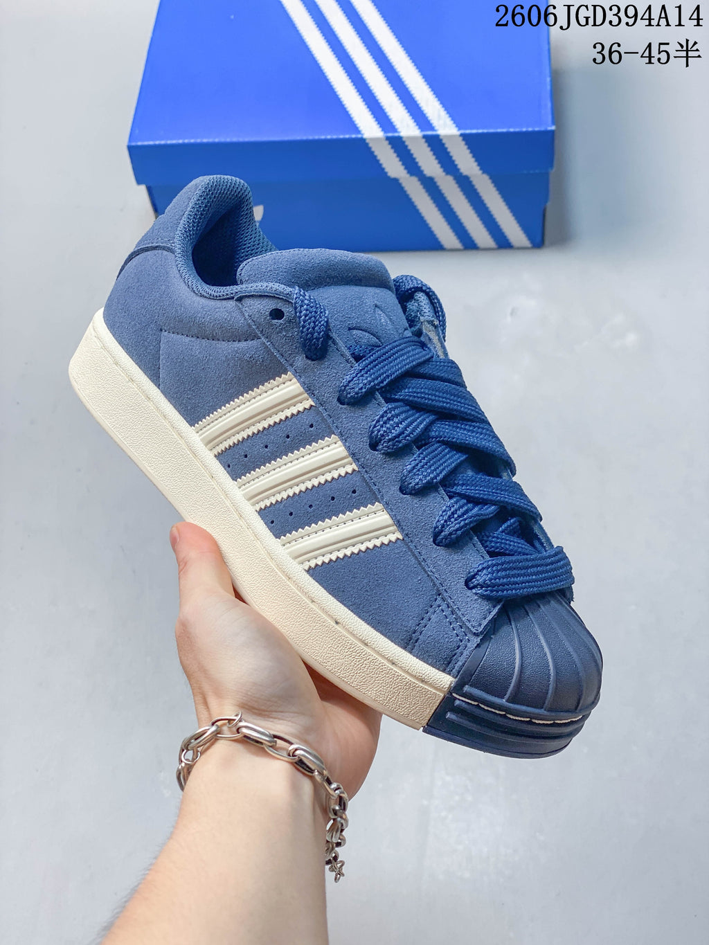 Angled side view of the blue sneaker with an off-white sole