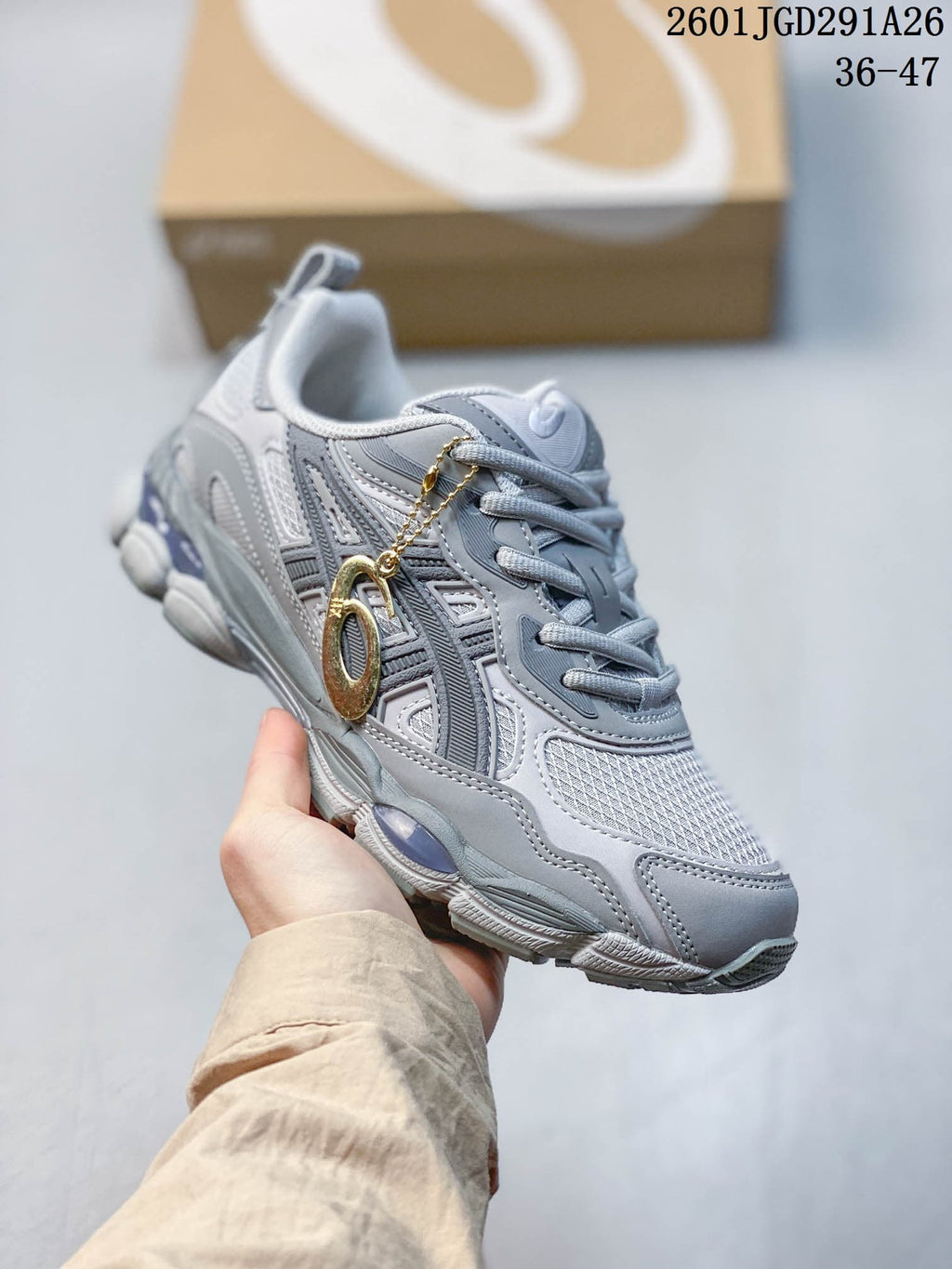 Side view of a gray ASICS GEL-NYC RGD sneaker