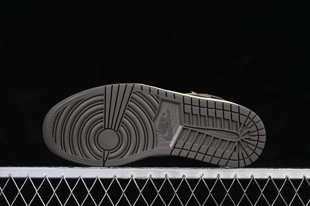 Dark outsole with circular forefoot tread pattern