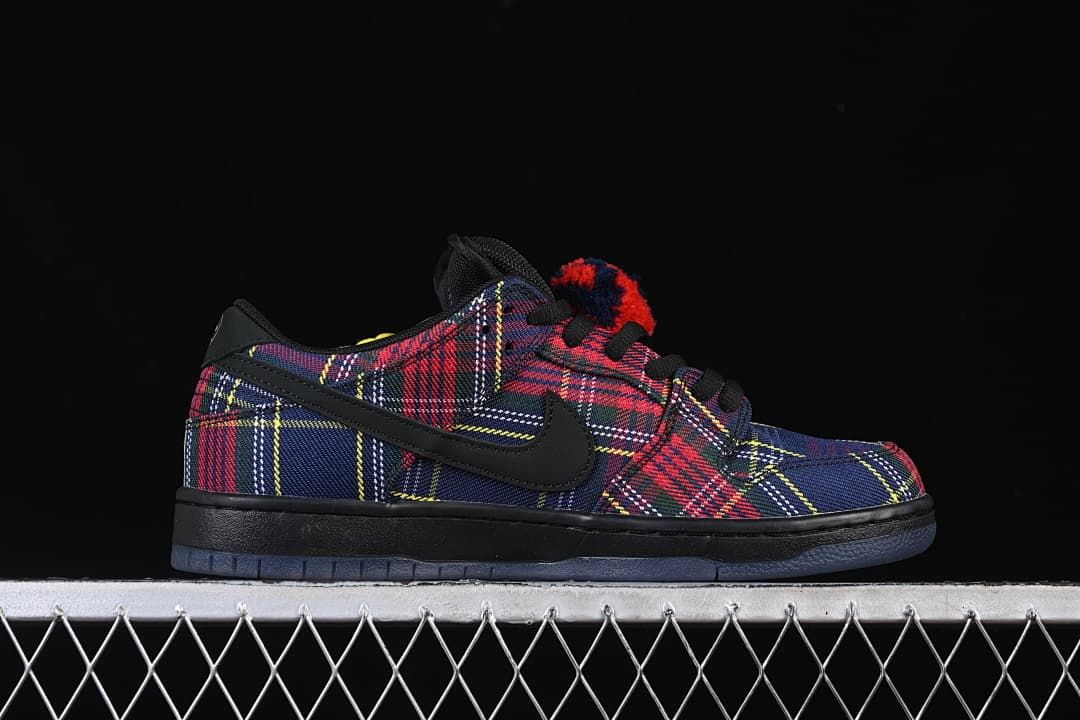 Side profile of the plaid sneakers with black Swoosh and dark outsole.
