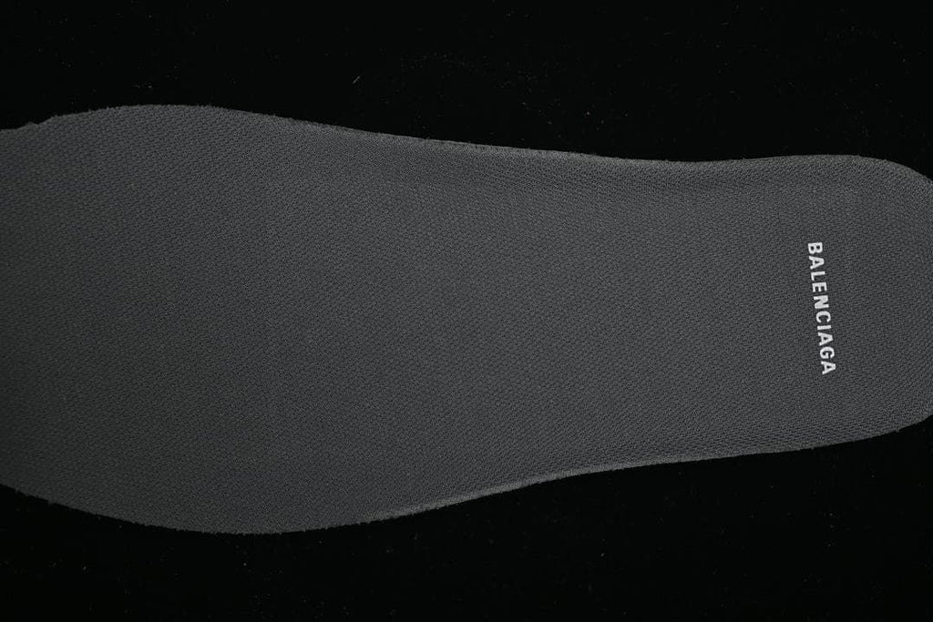 Close-up of the dark grey branded shoe insole