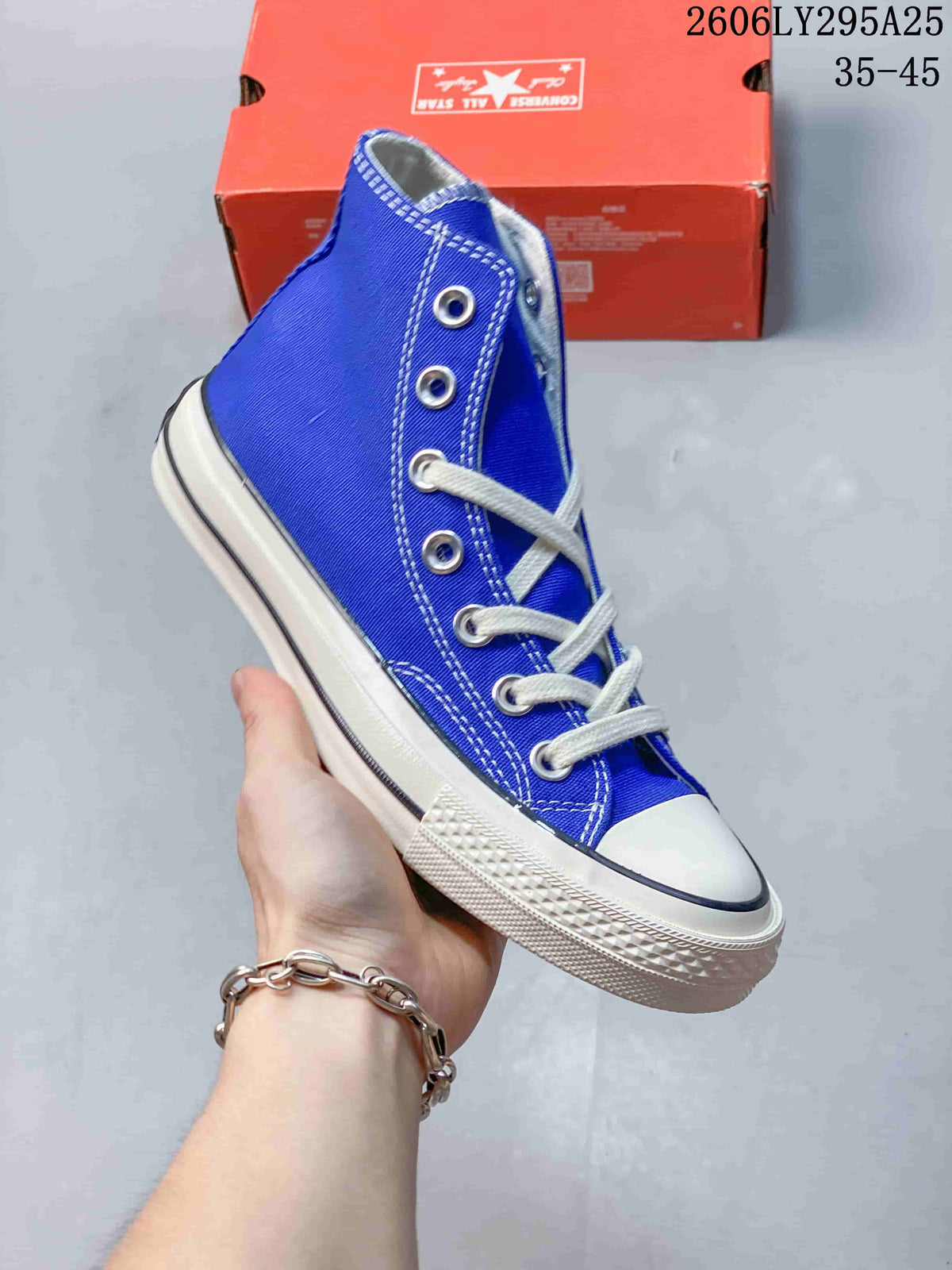 Blue Converse Chuck Taylor All Star high-top sneaker with white laces; image also displays size range 35–45.