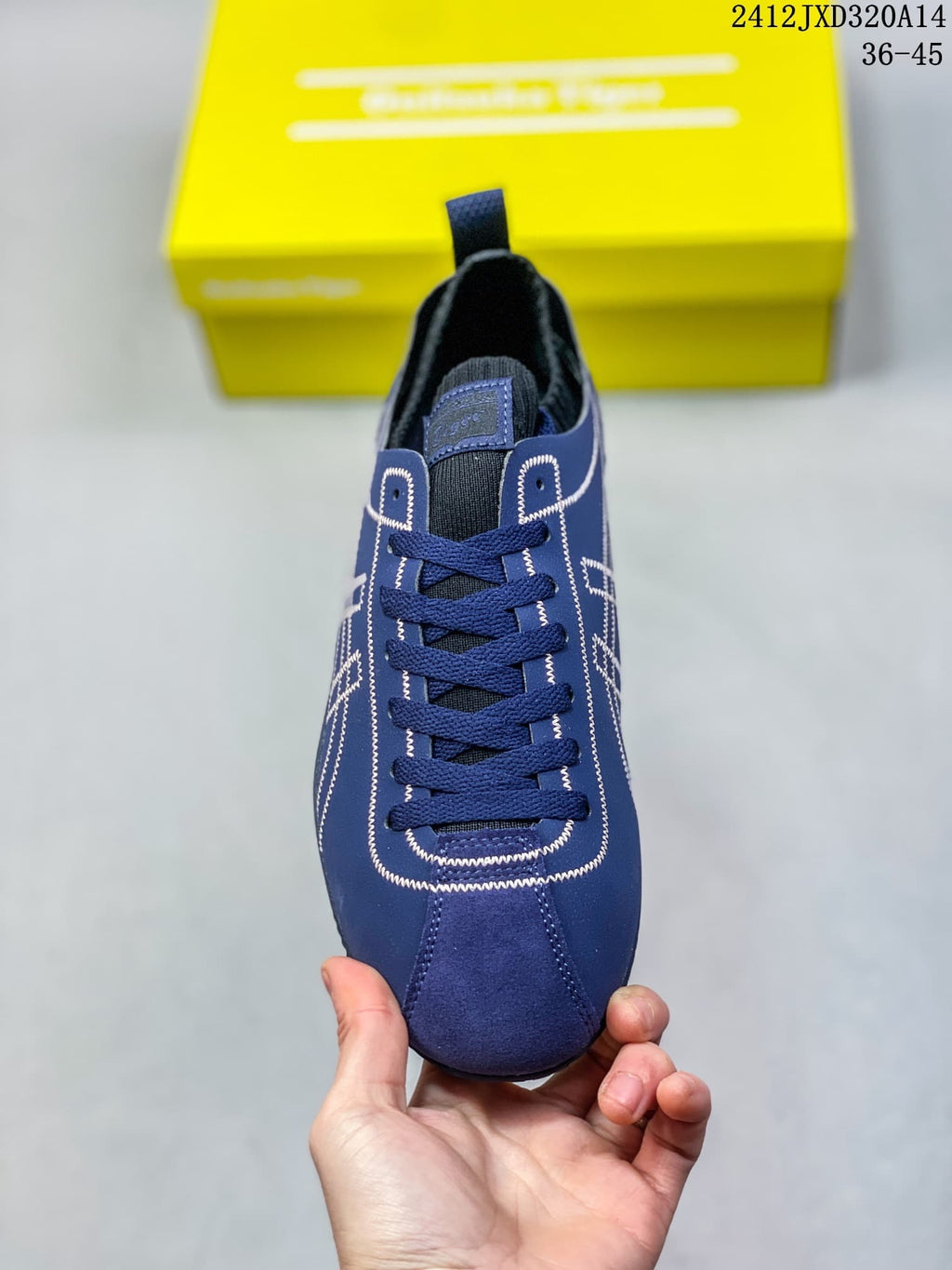 Front view of the sneaker showing its laces, tongue, and stitched detailing